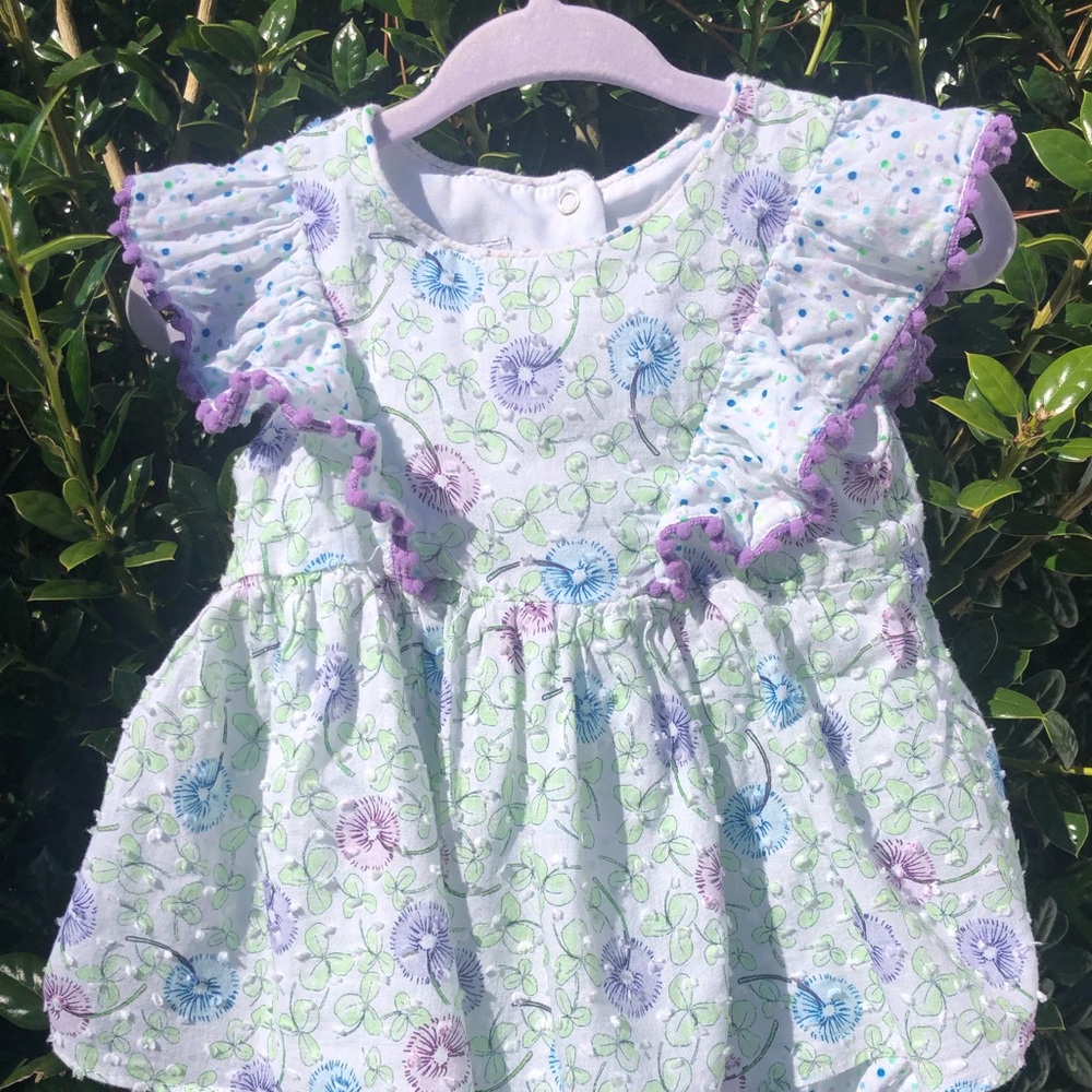 Lightly worn romper style dress Size 2. No damage or stains. Smoke free home.